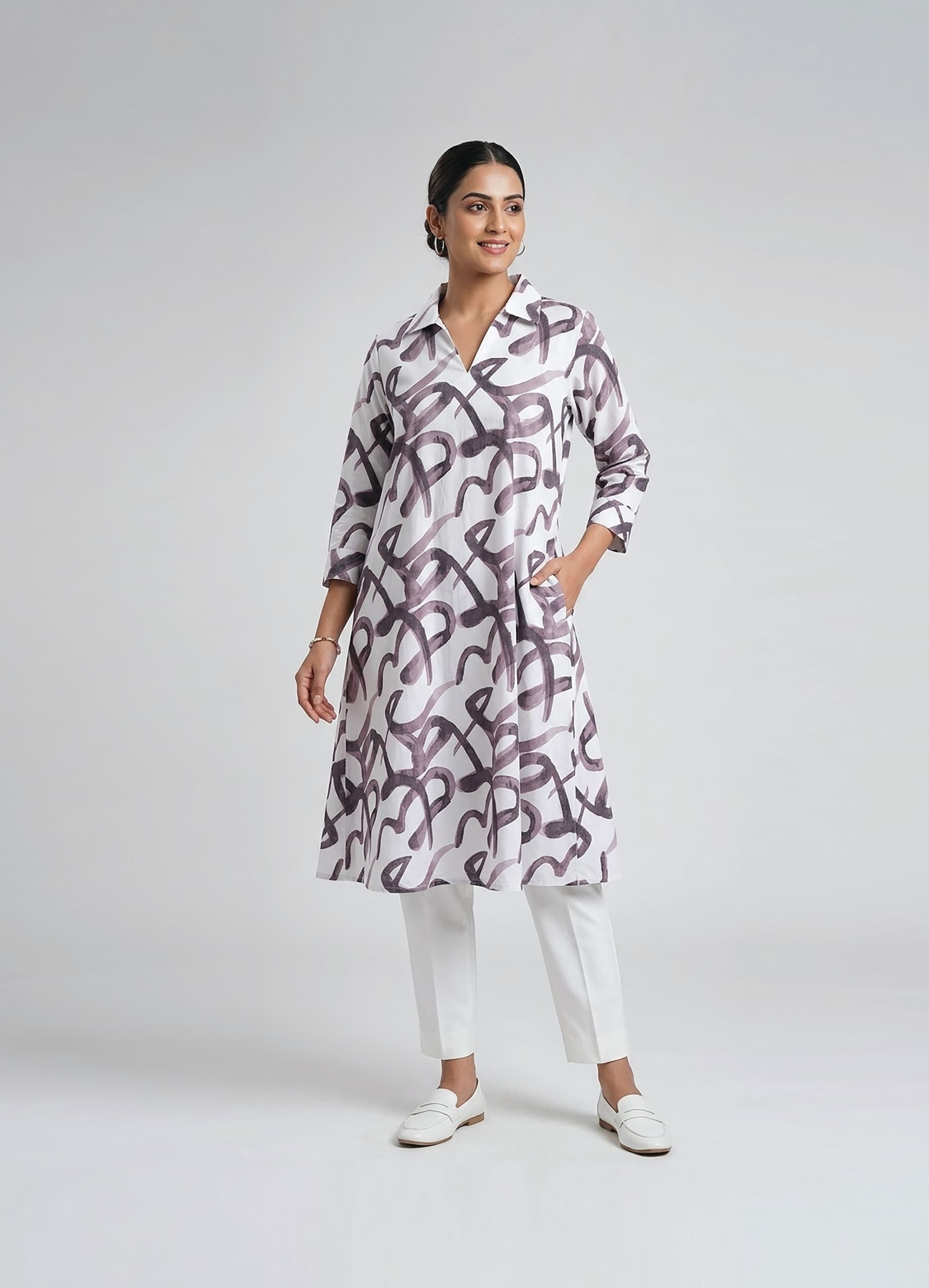 Amrita — Ivory A-line shirt dress in a brushed purple calligraphy print