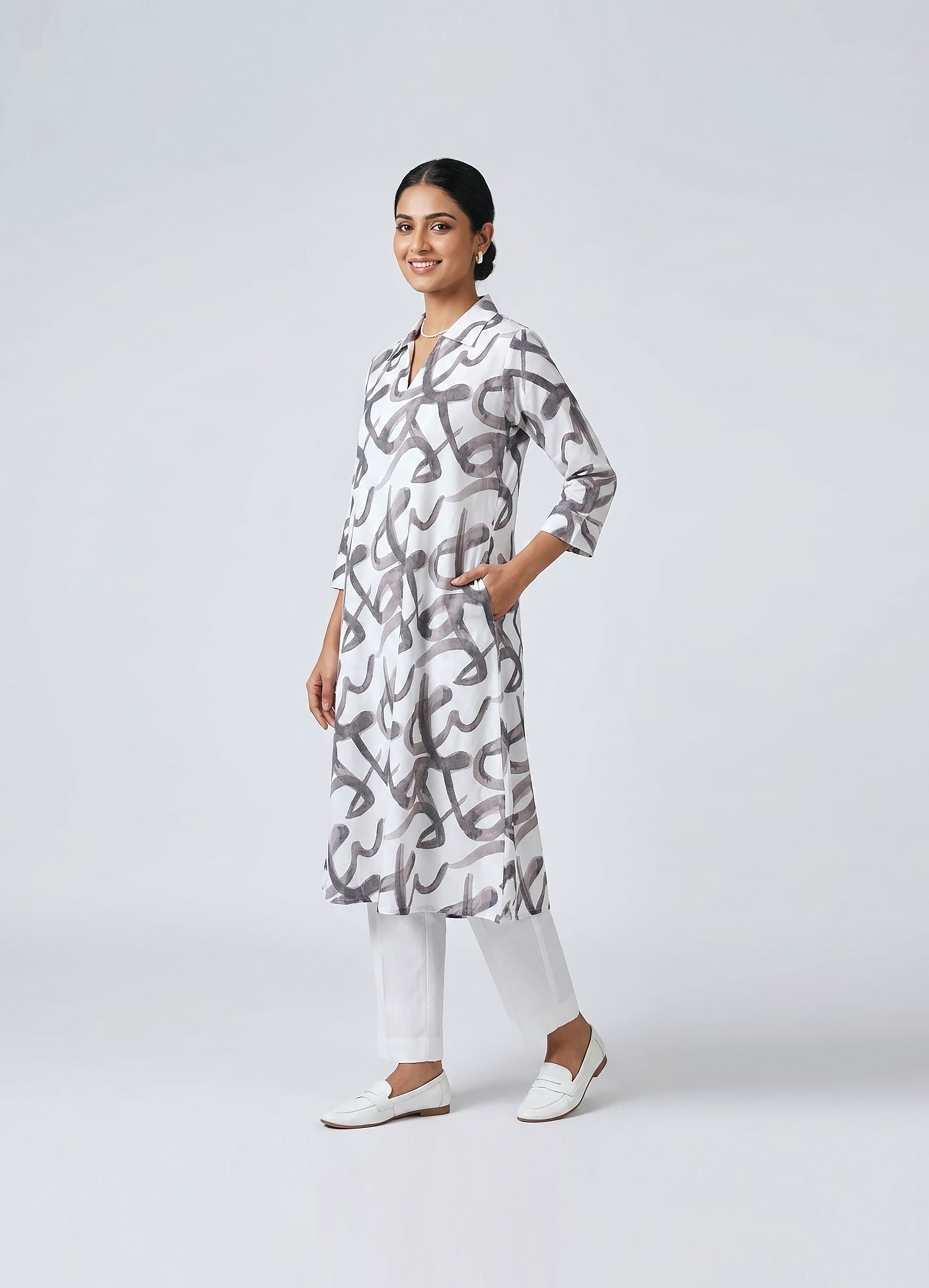 Ambika — Ivory A-line shirt dress in a brushed purple calligraphy print