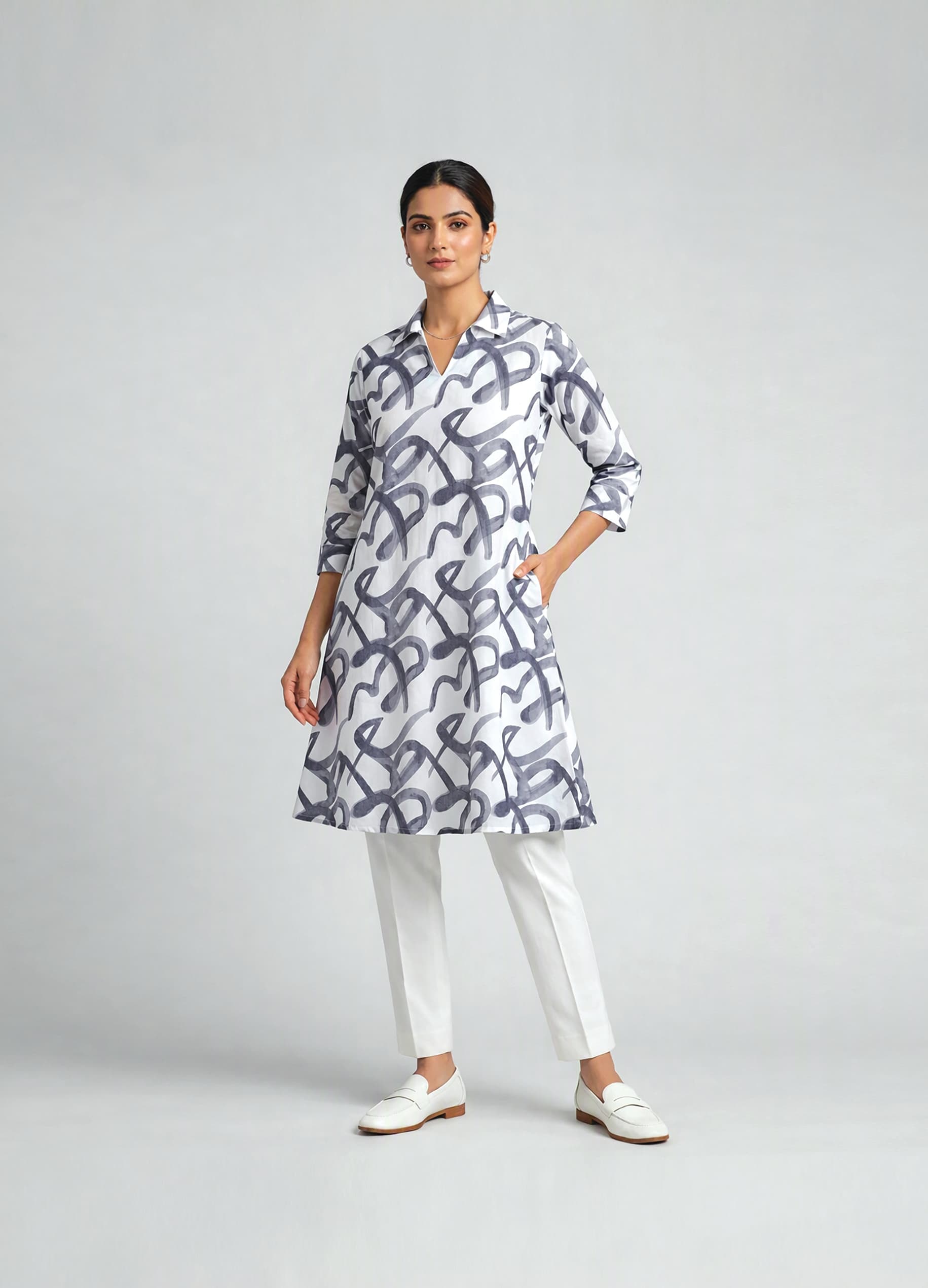 Aiswarya — Ivory A-line shirt dress in a brushed indigo calligraphy print