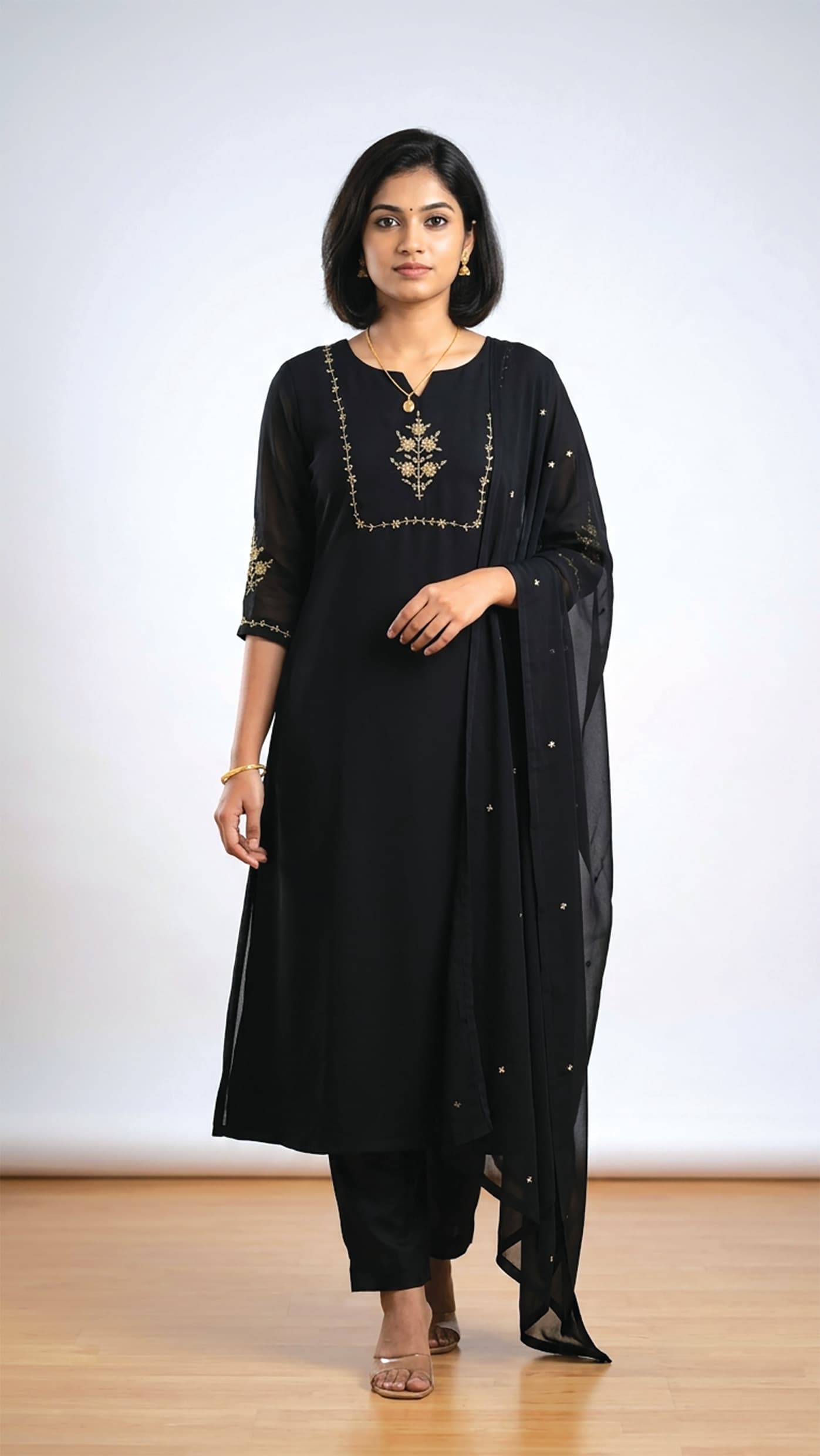 Janani — Black kurta set with gold floral embroidery and a sequinned dupatta