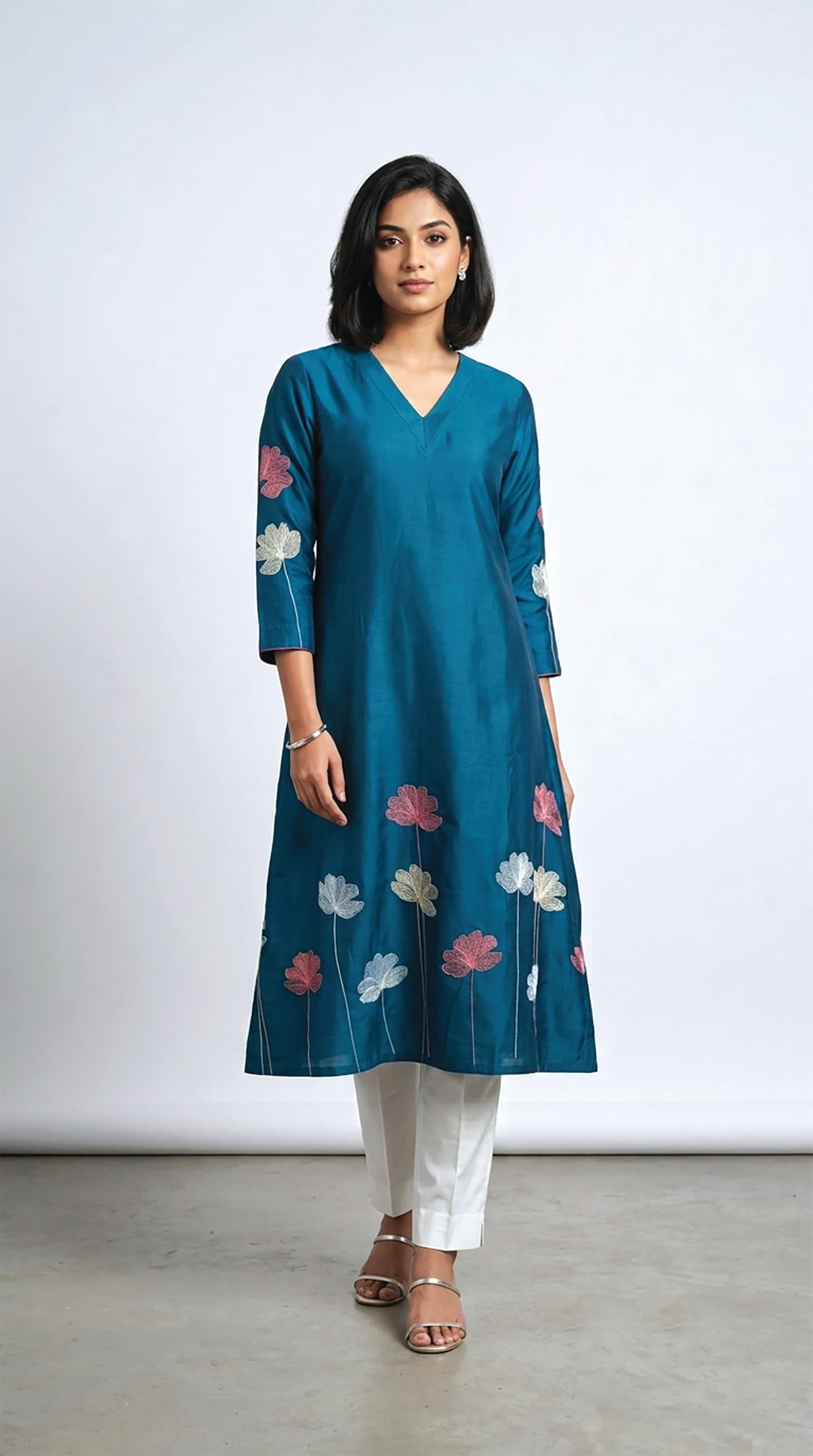 Ragini — Teal kurta scattered with lotus-bloom appliqué